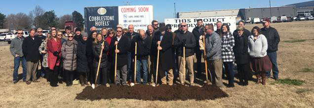 group with shovels in the dirt at the Newport, AR ground breaking ceremony