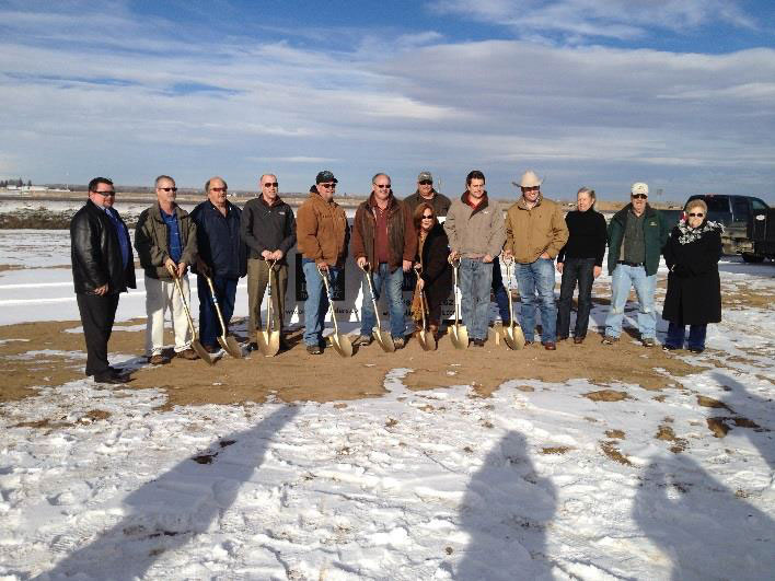 people with shovels at the ground breaking of the new cobblestone inn and suites 