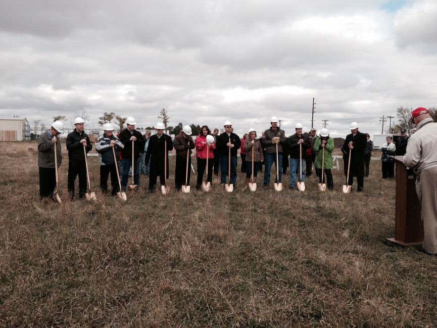 people with shovels breaking ground at the new cobblestone inn and suites 