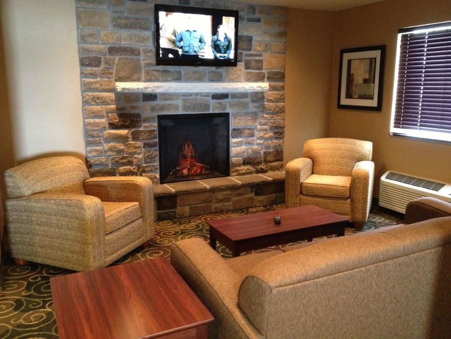 lobby area with fireplace at cobblestone inn and suites 