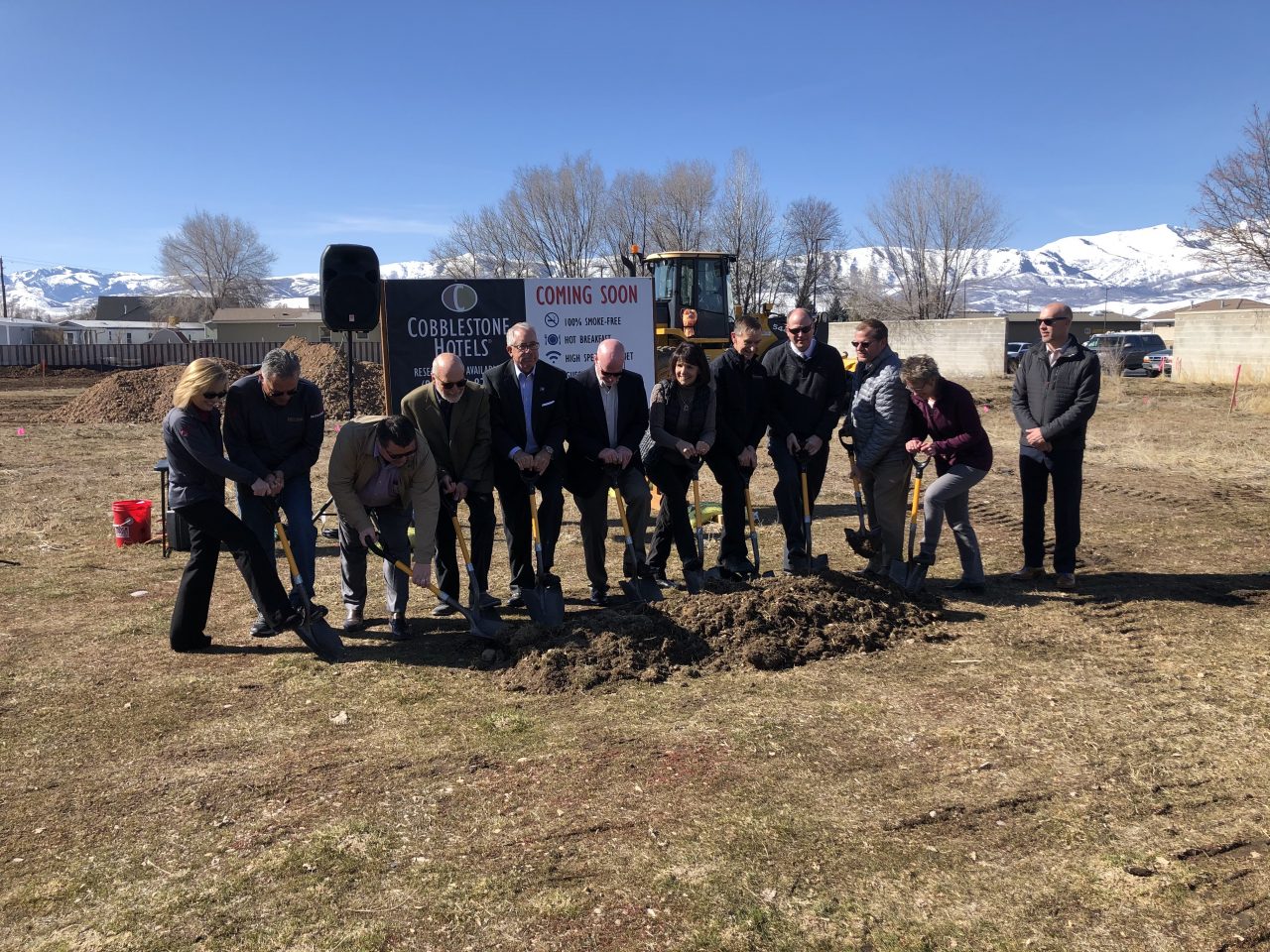 people breaking ground at the new cobblestone hotel and suites 