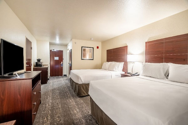 two queen beds room at Cobblestone Hotel & Suites in Cozad, Nebraska