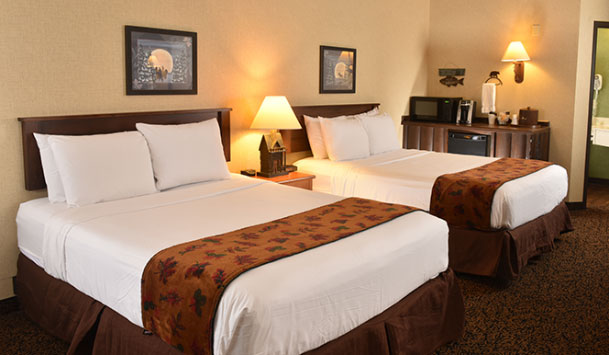 double beds guest room at Boarders Inn & Suites by Cobblestone Hotels in Waukon, Iowa