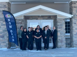 A group of women in uniform standing in front of a building

Description automatically generated with low confidence